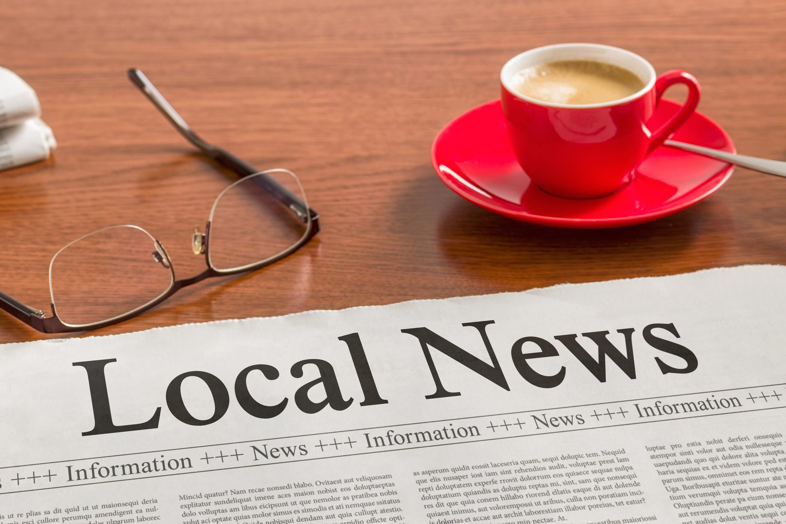 A newspaper on a wooden desk - Local News Digital Marketing Services Indiana